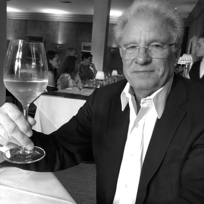 James Biesecker with a glass of wine